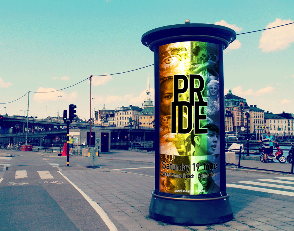 Street totem sign displaying pride poster